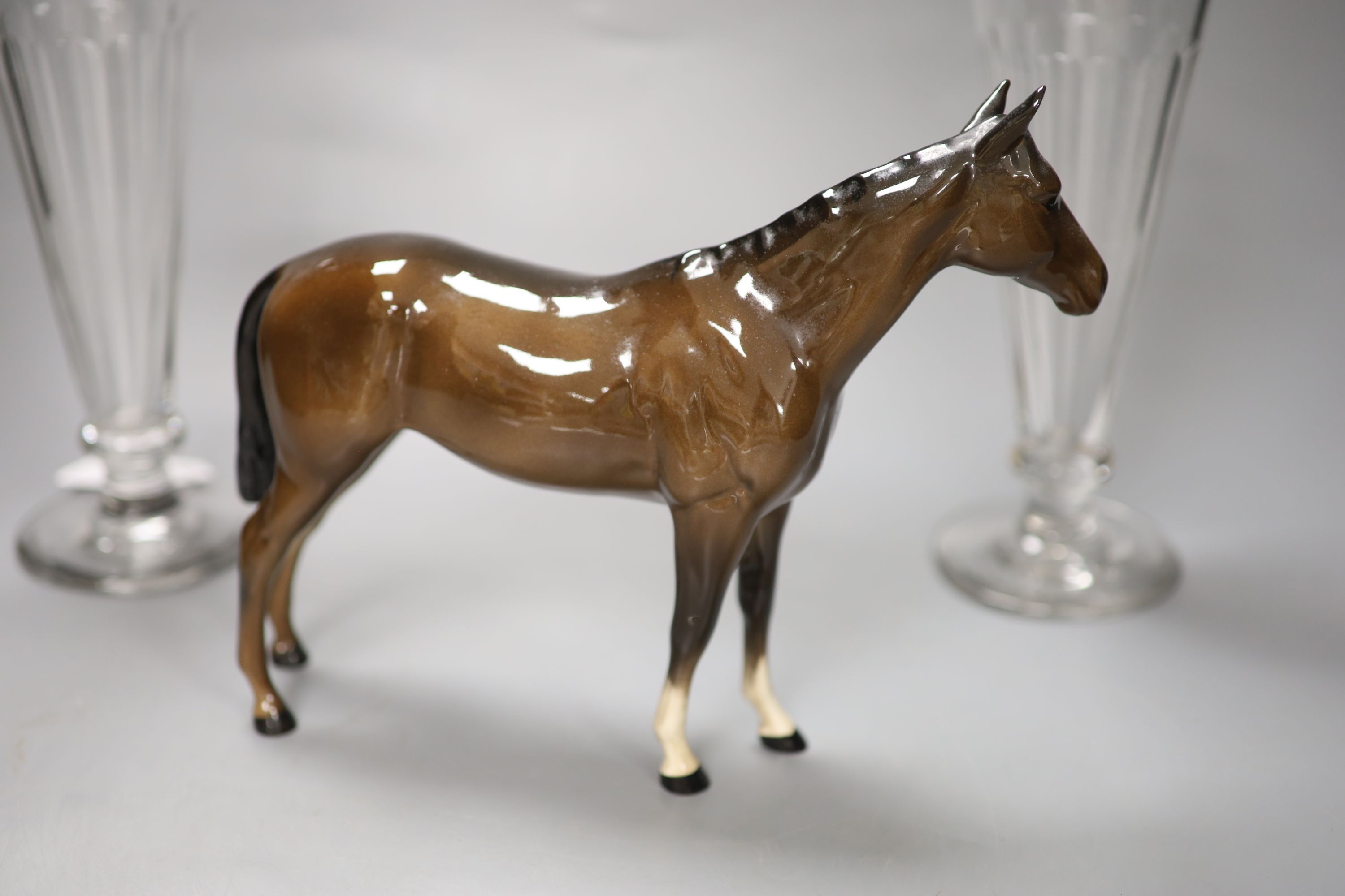 A pair of panel-cut ale flutes, 24cm high and a Beswick bay stallion